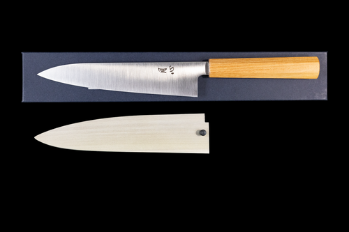 Gesshin Ginga 210mm carbon wa gyuto with a polished blade and light zelkova octagonal handle shown above its matching wooden sheath on black background
