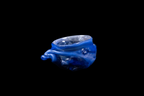 Handmade cobalt blue glass vessel with an ocean inspired rippled form and rounded opening displayed against a black background