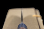Gen 150mm Kurouchi Santoku, choil view head-on, showing blade thickness from edge to spine