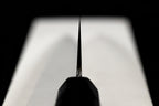 Choil view of the Gesshin Uraku 210mm White #1 Mizu Honyaki Wa-Gyuto showing blade thinness and taper toward the tip