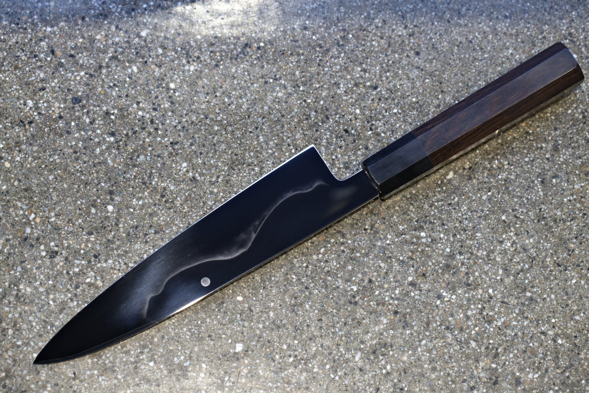 Gesshin Uraku 210mm White #1 Mizu Honyaki Wa-Gyuto on granite showing the mizu honyaki hamon
