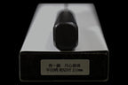 End of the black octagonal handle on the Gesshin Kagekiyo 210mm Blue #1 Kiritsuke Wa-Gyuto, resting on its box with label