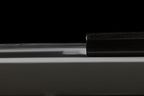 Spine of the Gesshin Kagekiyo 210mm Blue #1 Kiritsuke Wa-Gyuto where the blade meets the black octagonal handle