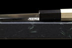 Spine of the Gesshin Uraku 120mm White #2 Deba where the blade meets the black ferrule and octagonal handle