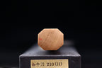 End view of the octagonal ho wood handle from an Ashi Hamono Gesshin Ginga 210mm carbon wa gyuto resting on its labeled black presentation box